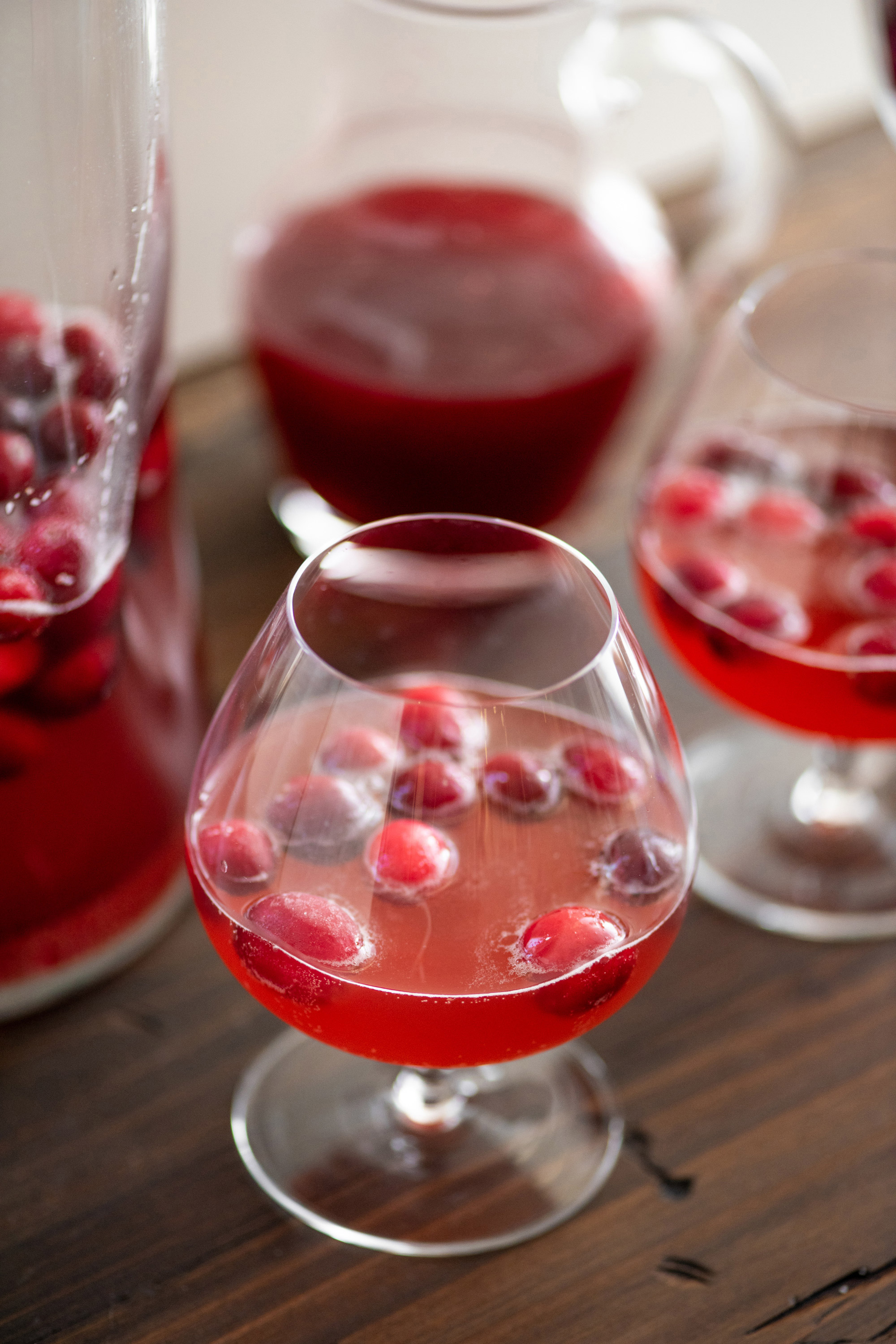 Cranberry shrub in a brandy glass.