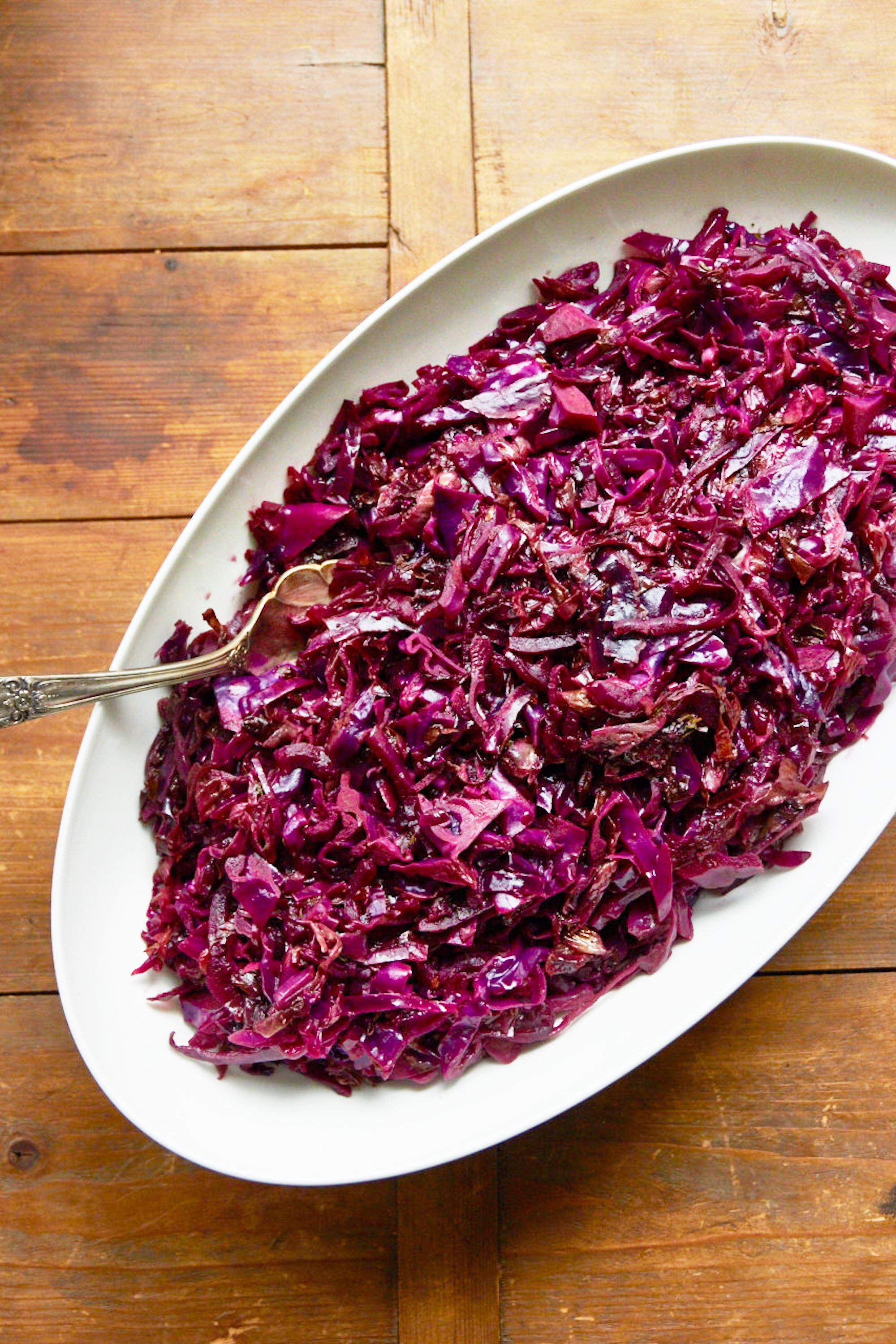 Braised Red Cabbage in a white oval serving bowl.