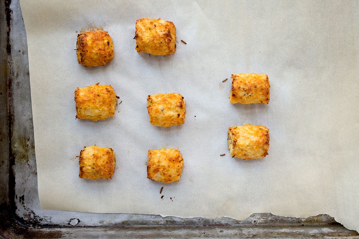 Cauliflower tots on baking sheet.