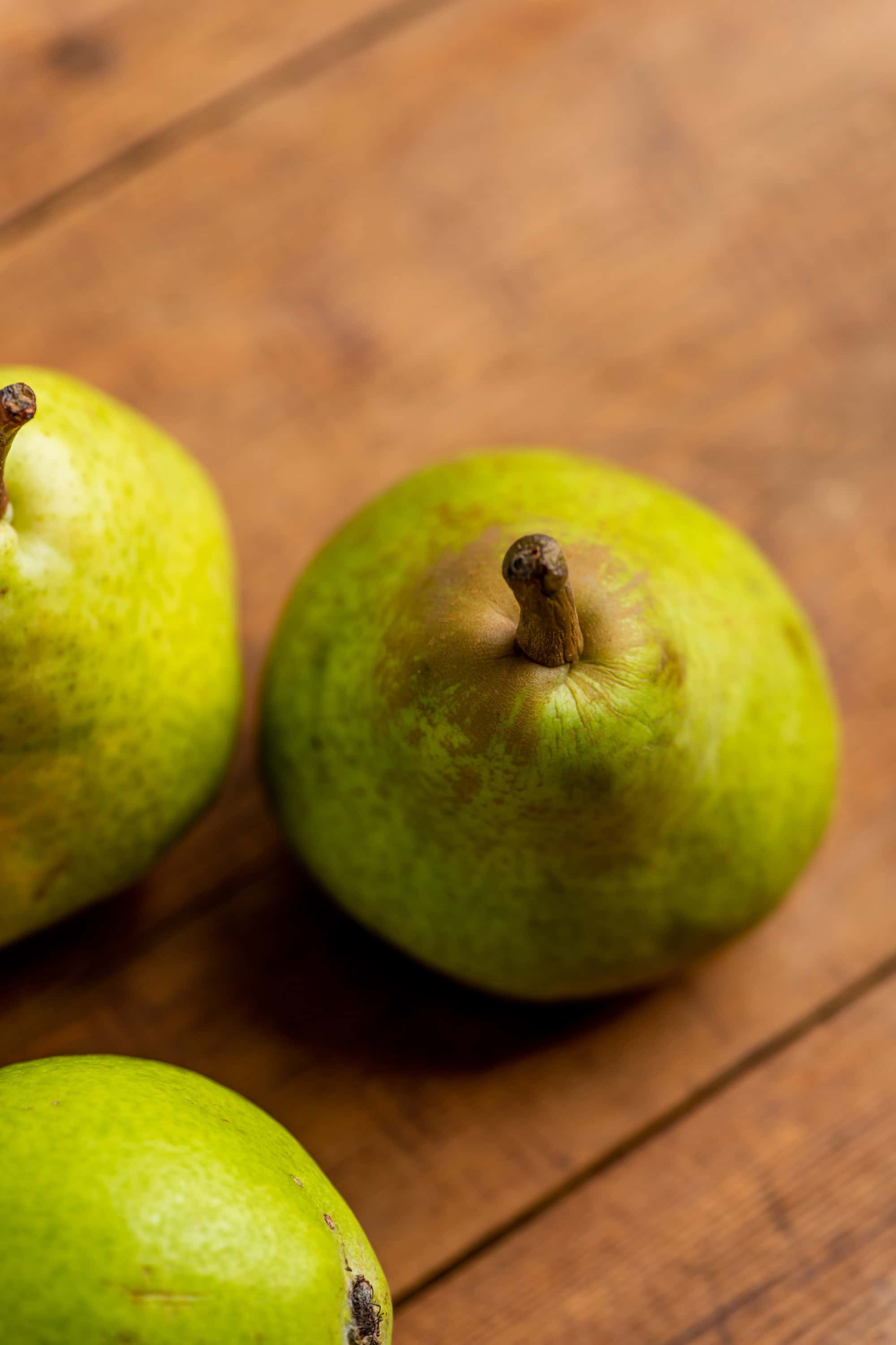 Pears on a wooden surafce.