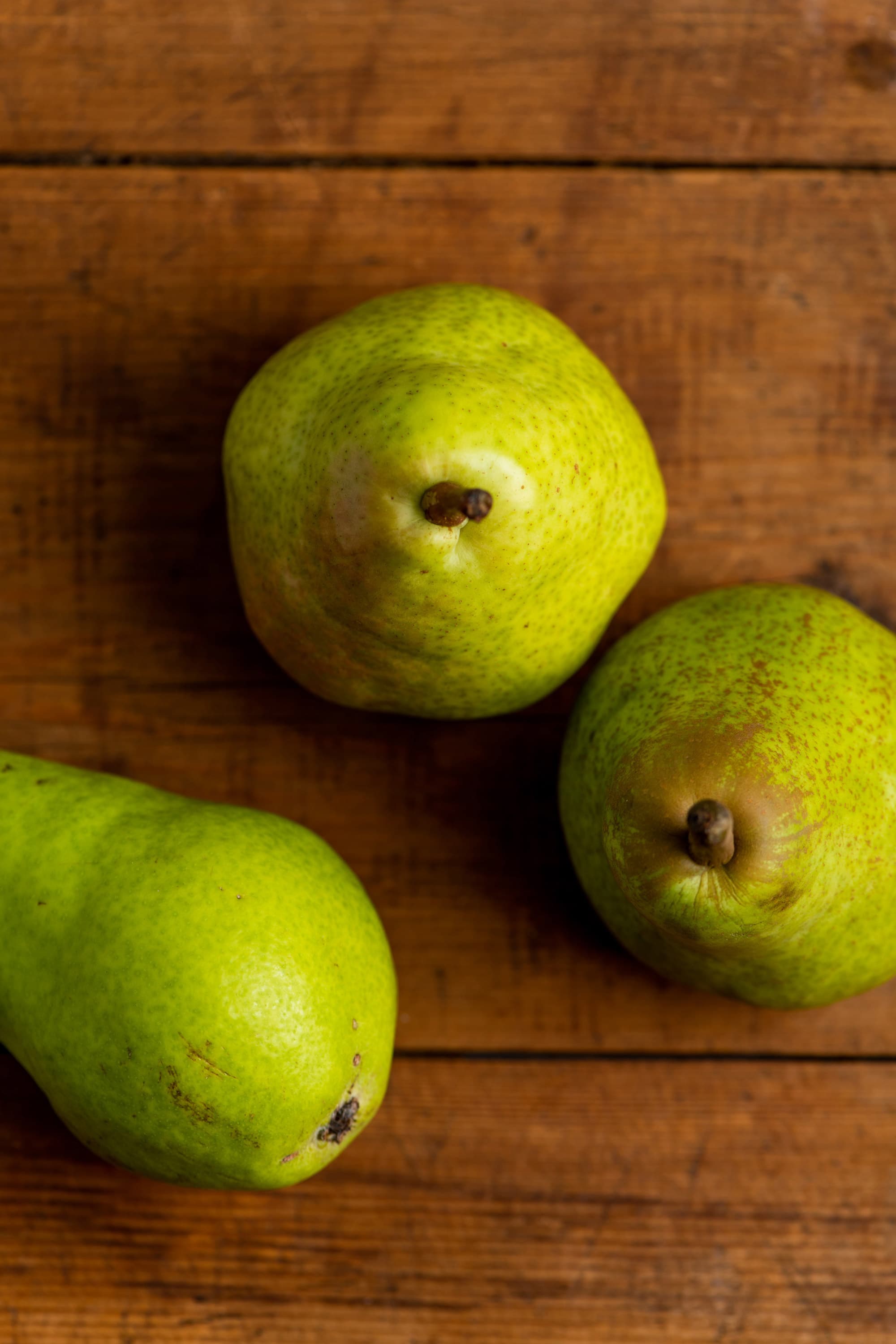 Pears on a wooden surface.
