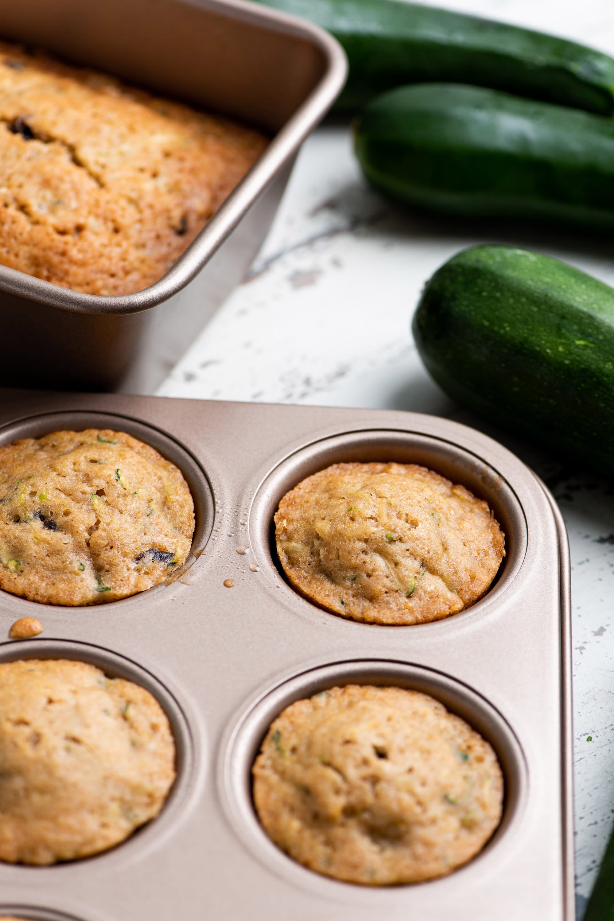 Zucchini Bread and Muffins in baking pans.