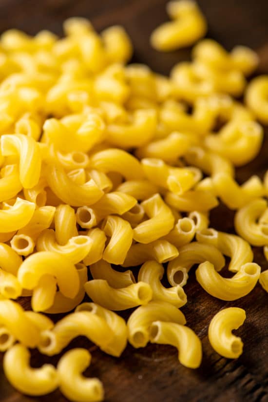 Uncooked pasta noodles on a table.