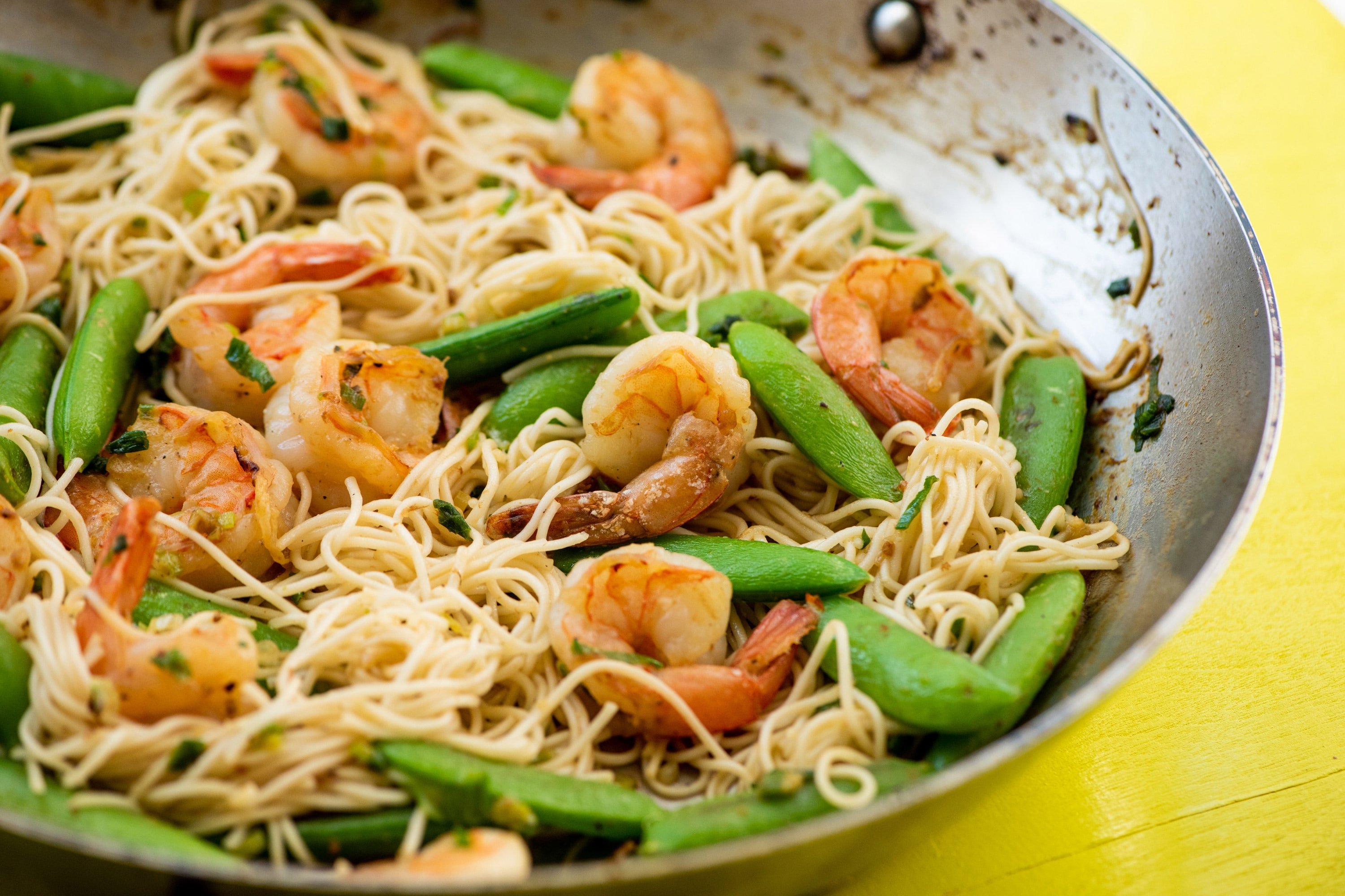 Shrimp, Sugar Snap Pea and Scallion Stir Fry with Miso Sauce in a pan.