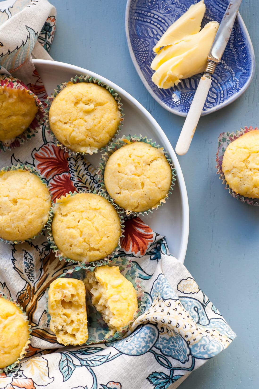 Pepper Jack and Green Chili Corn Muffins in a bowl and on a table.