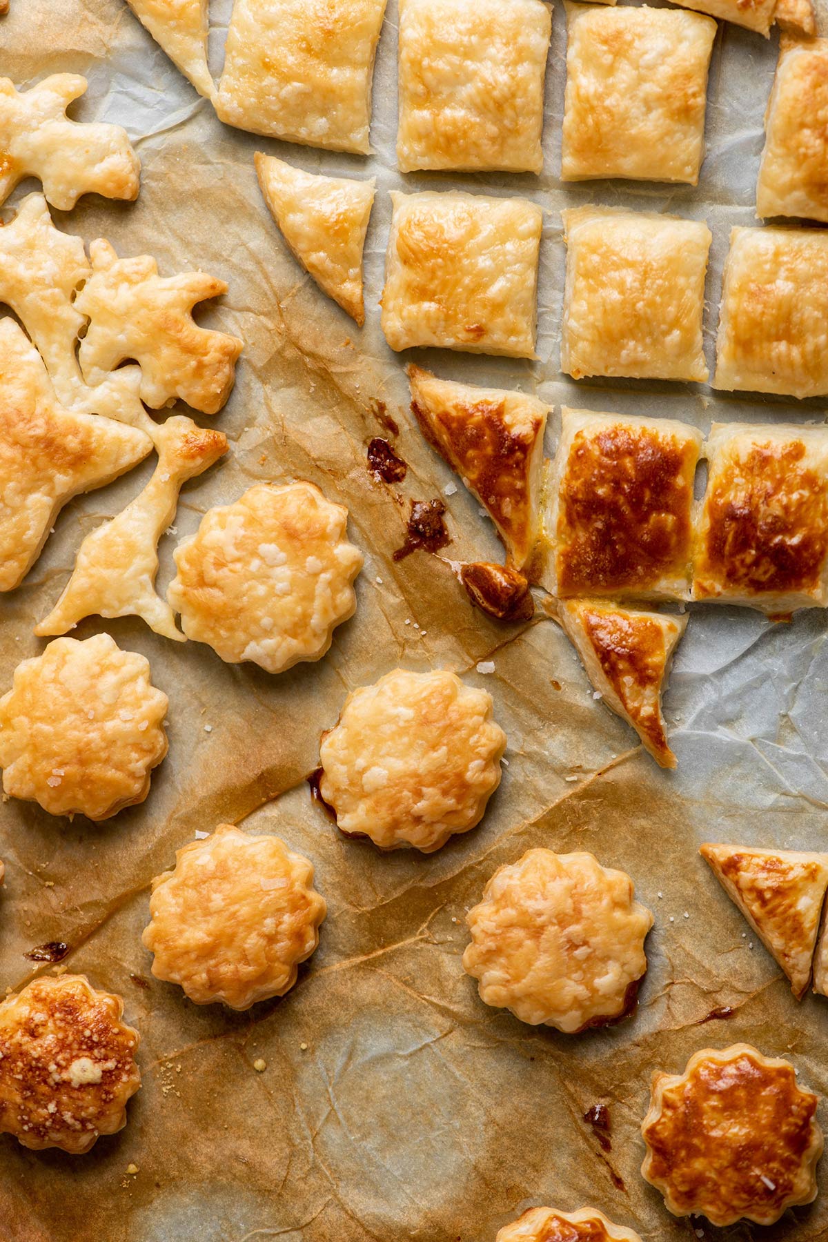 Cooked puff pastry in a variety of shapes.