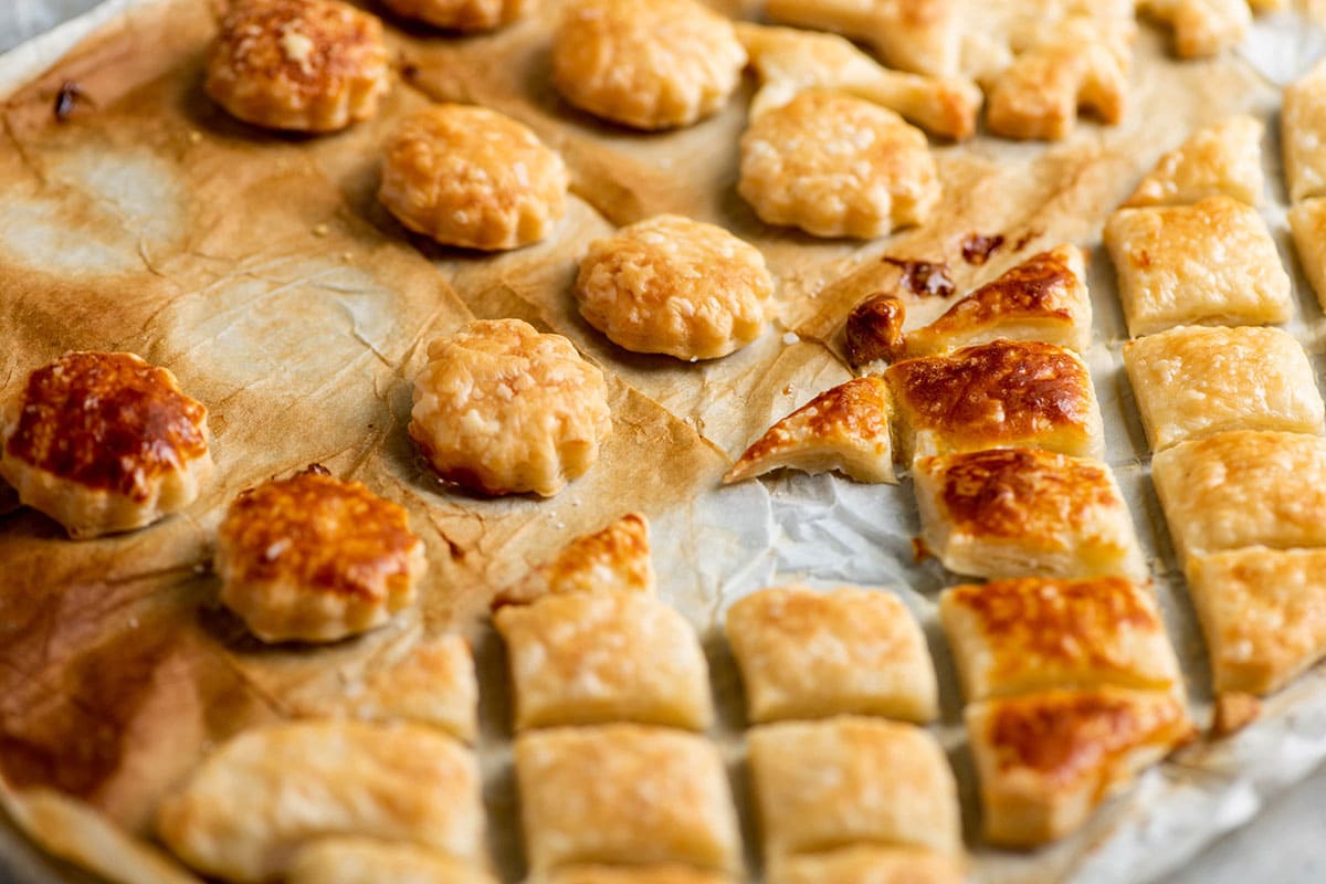 Puff pastry croutons on baking sheet.