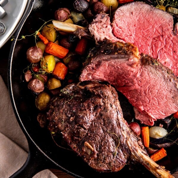 Skillet of vegetables and Standing Rib Roast.