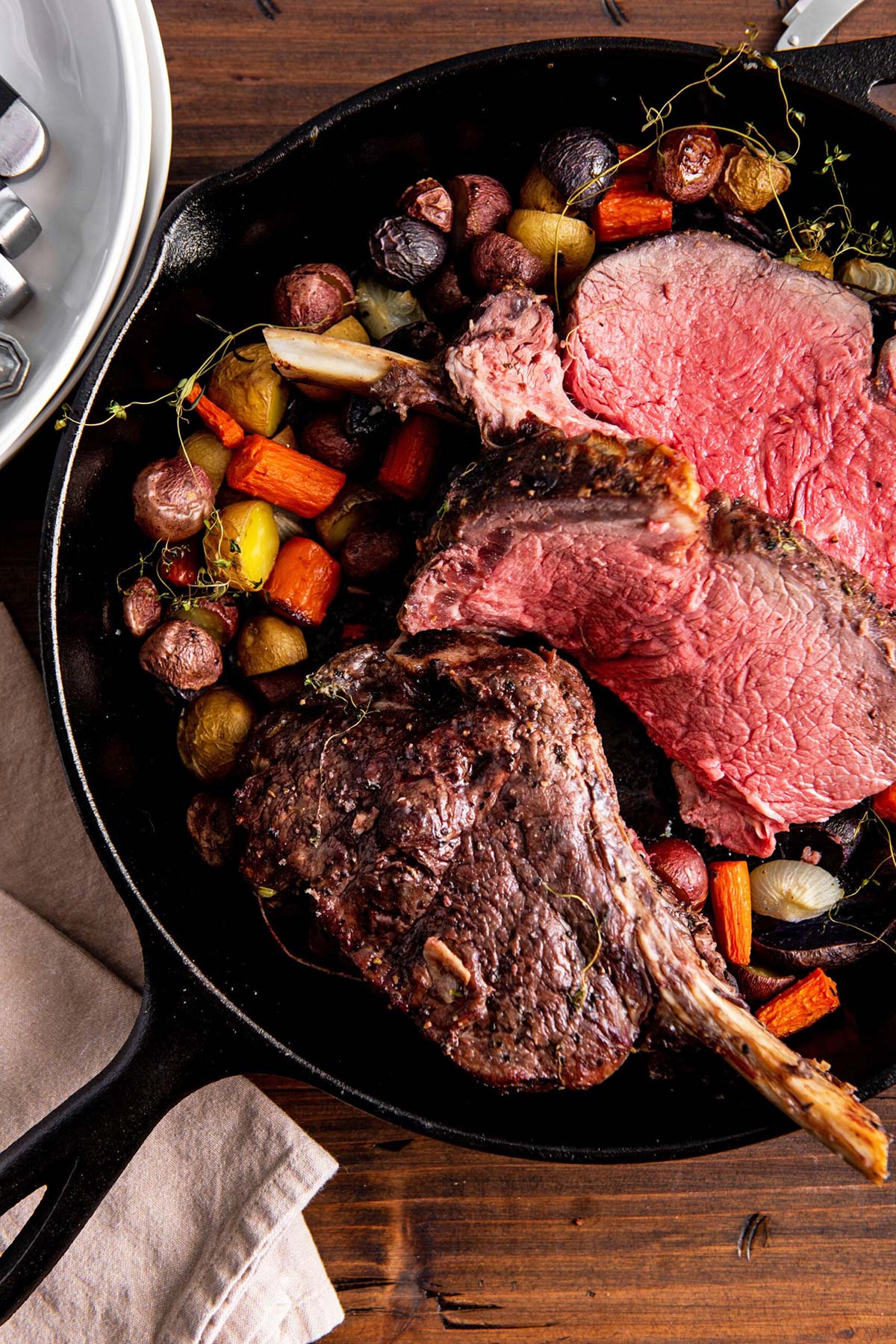 Skillet of vegetables and Standing Rib Roast.