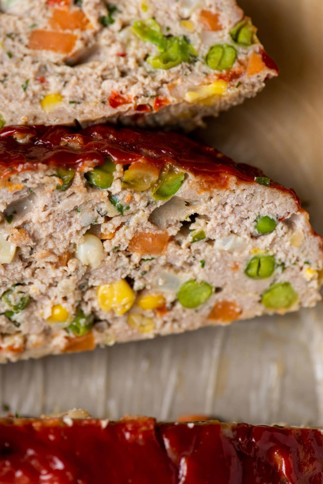 Peas, corn, red pepper, and other vegetables in a Turkey Meatloaf.