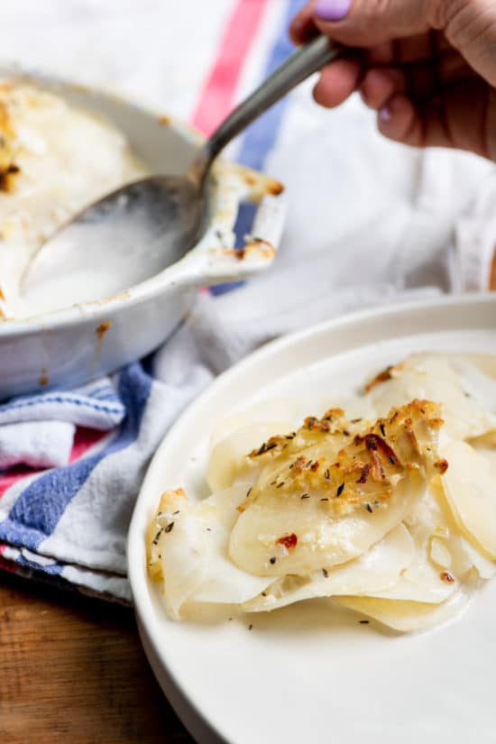 Creamy Scalloped Potatoes served on a plate