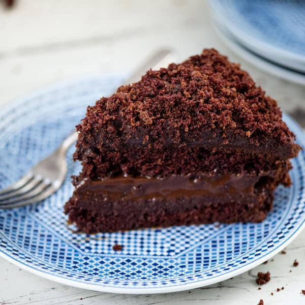 Slice of Ebinger’s Blackout Cake on a plate with a fork.