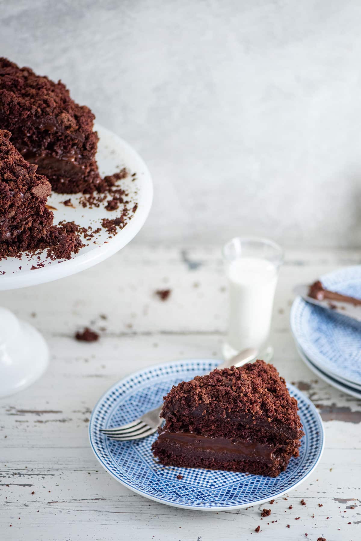Slice of Ebinger’s Blackout Cake on a blue plate.