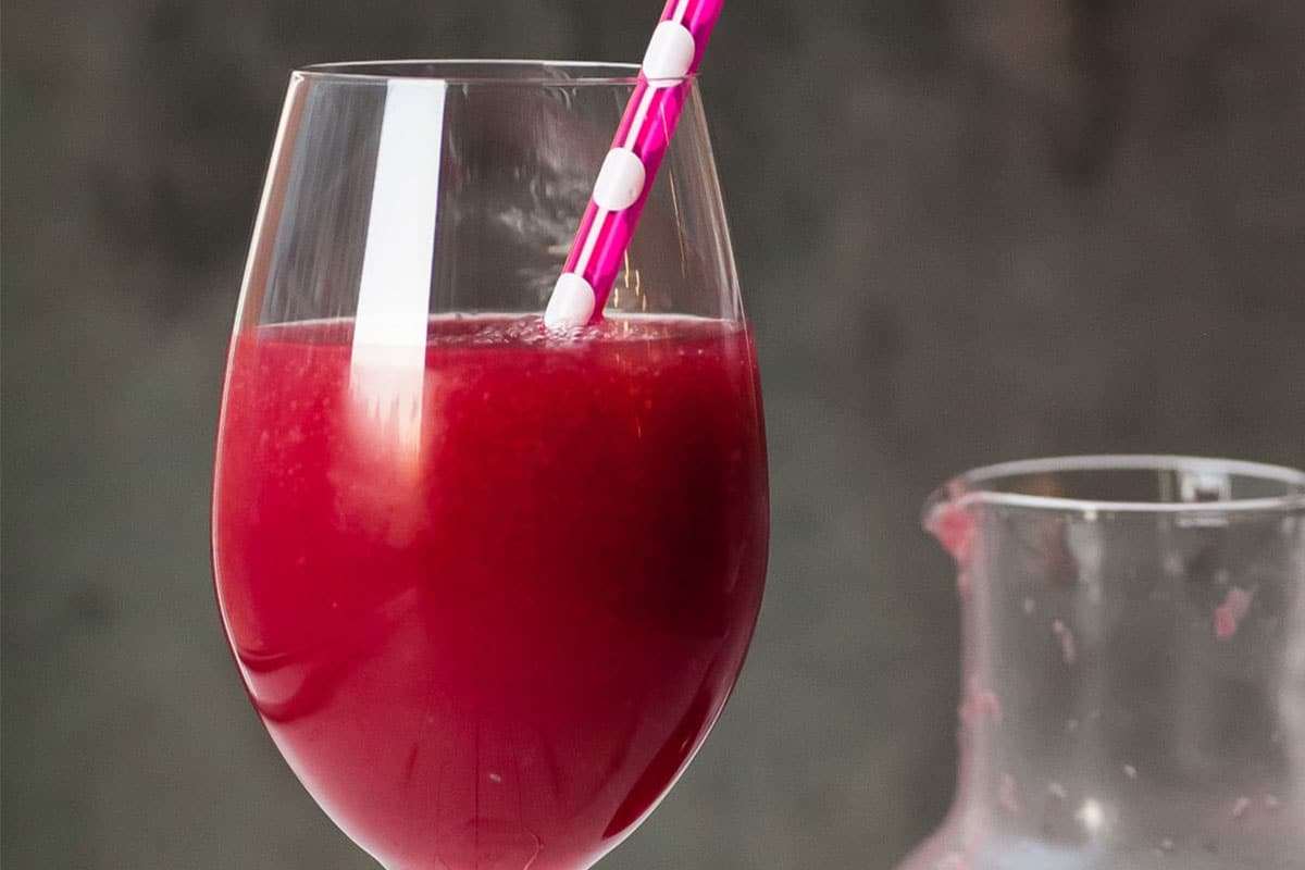 Frozen pomegranate cocktail in glass.