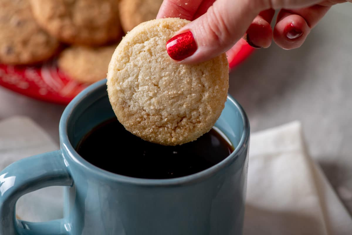 Dipping Pamela's cookie in a cup of coffee