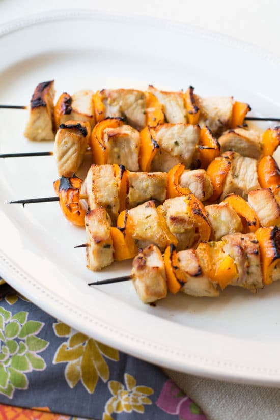 Five Mustard and Maple Pork Kebabs on a platter.