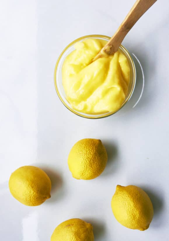 Lemons and Lemon Curd on a table.