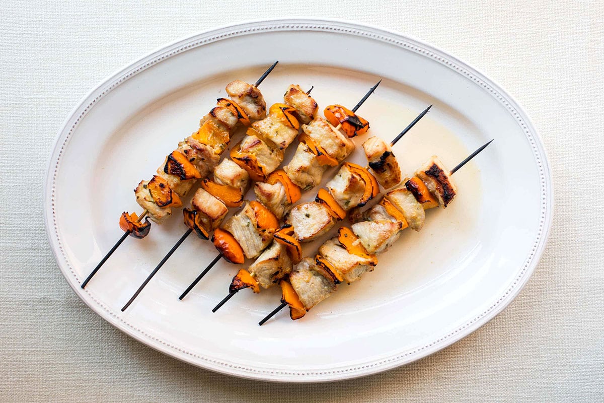 White serving platter of Mustard and Maple Pork Kebabs.