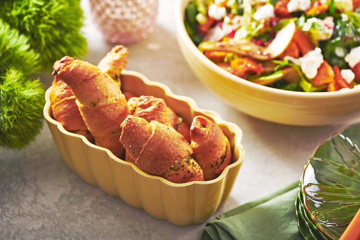 Pesto Crescent Rolls piled in a serving bowl.