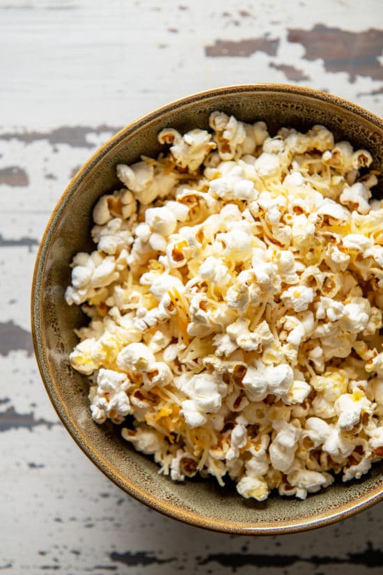 Cheddar Cheese Popcorn piled in a bowl.