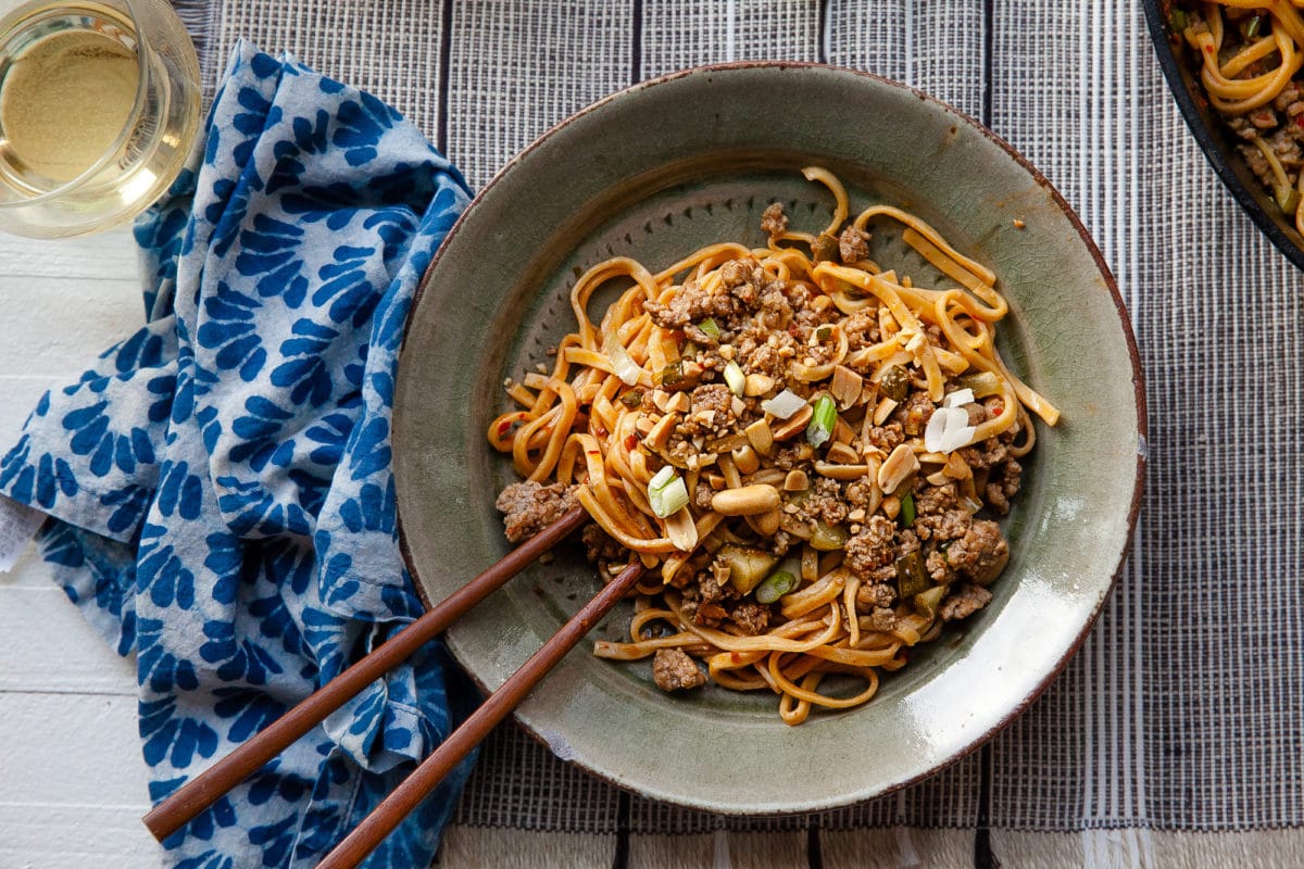 Grey and brown plate with Dan Dan Noodles.