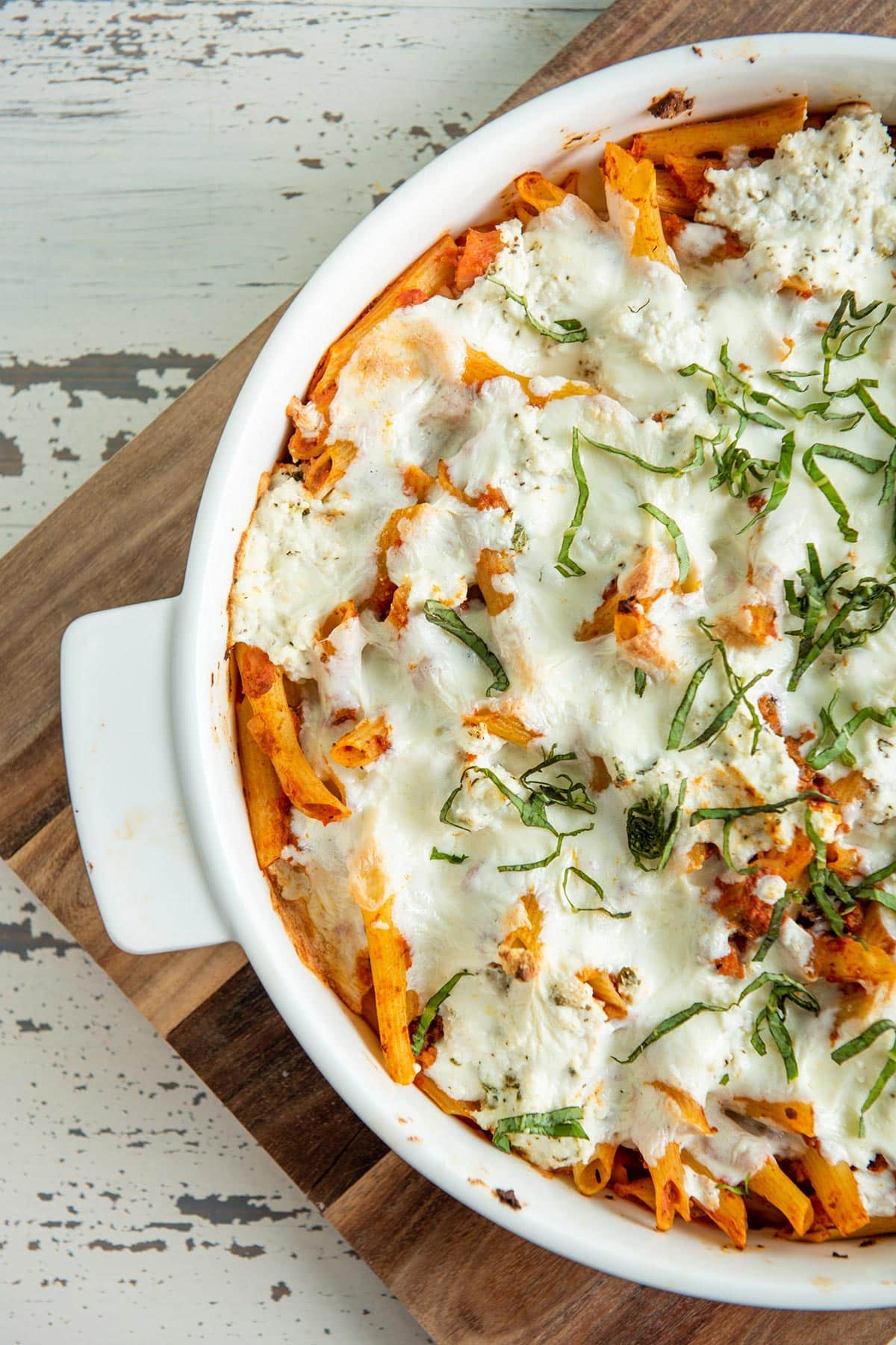 White dish of Baked Pasta with Bolognese Sauce.