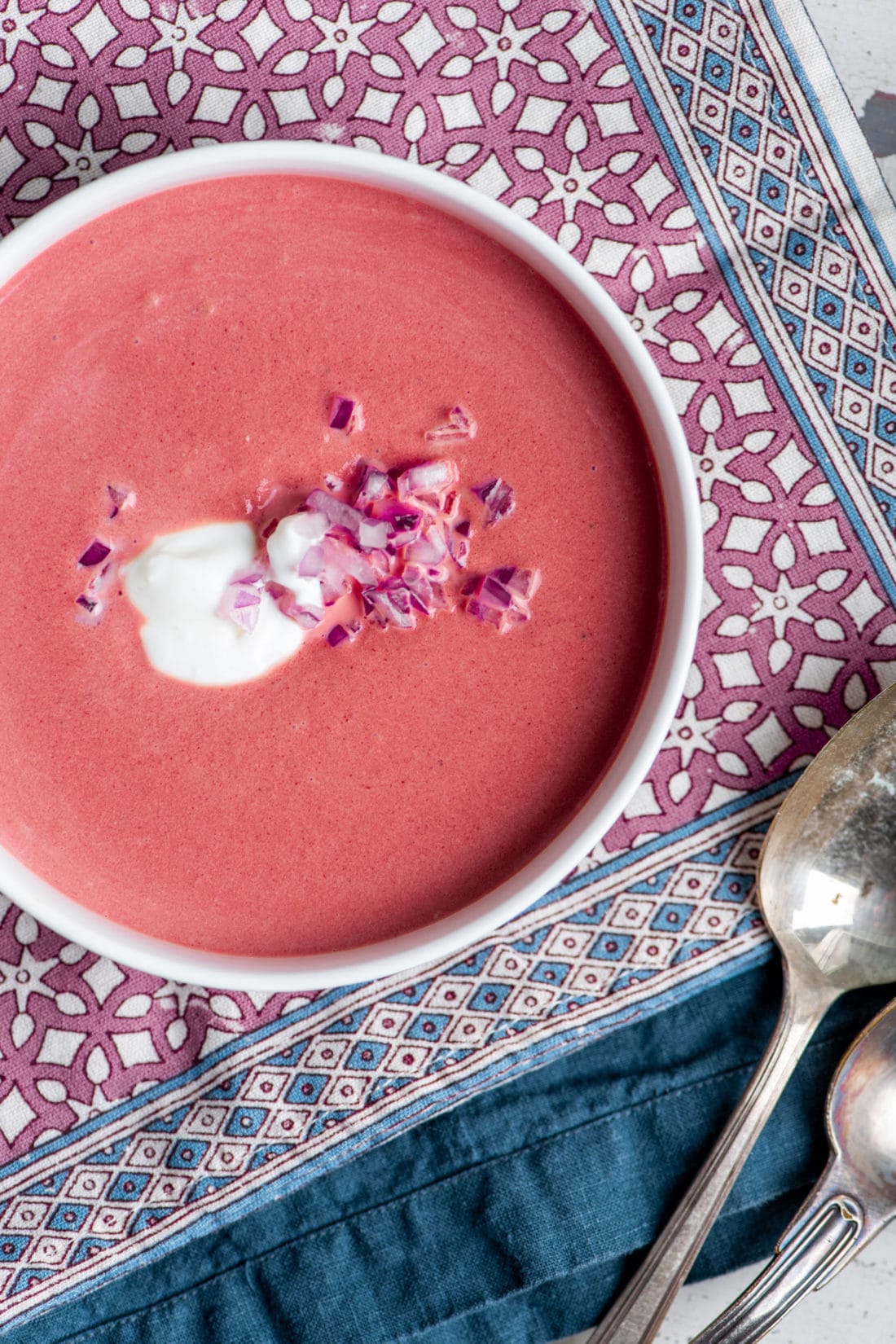 Bowl of pink Creamy Roasted Beet Soup.
