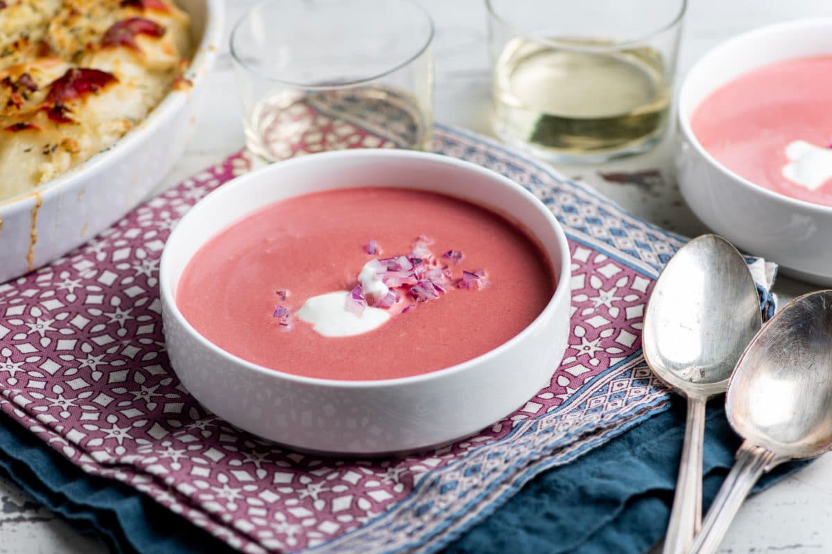 Creamy Roasted Beet Soup in a white bowl.