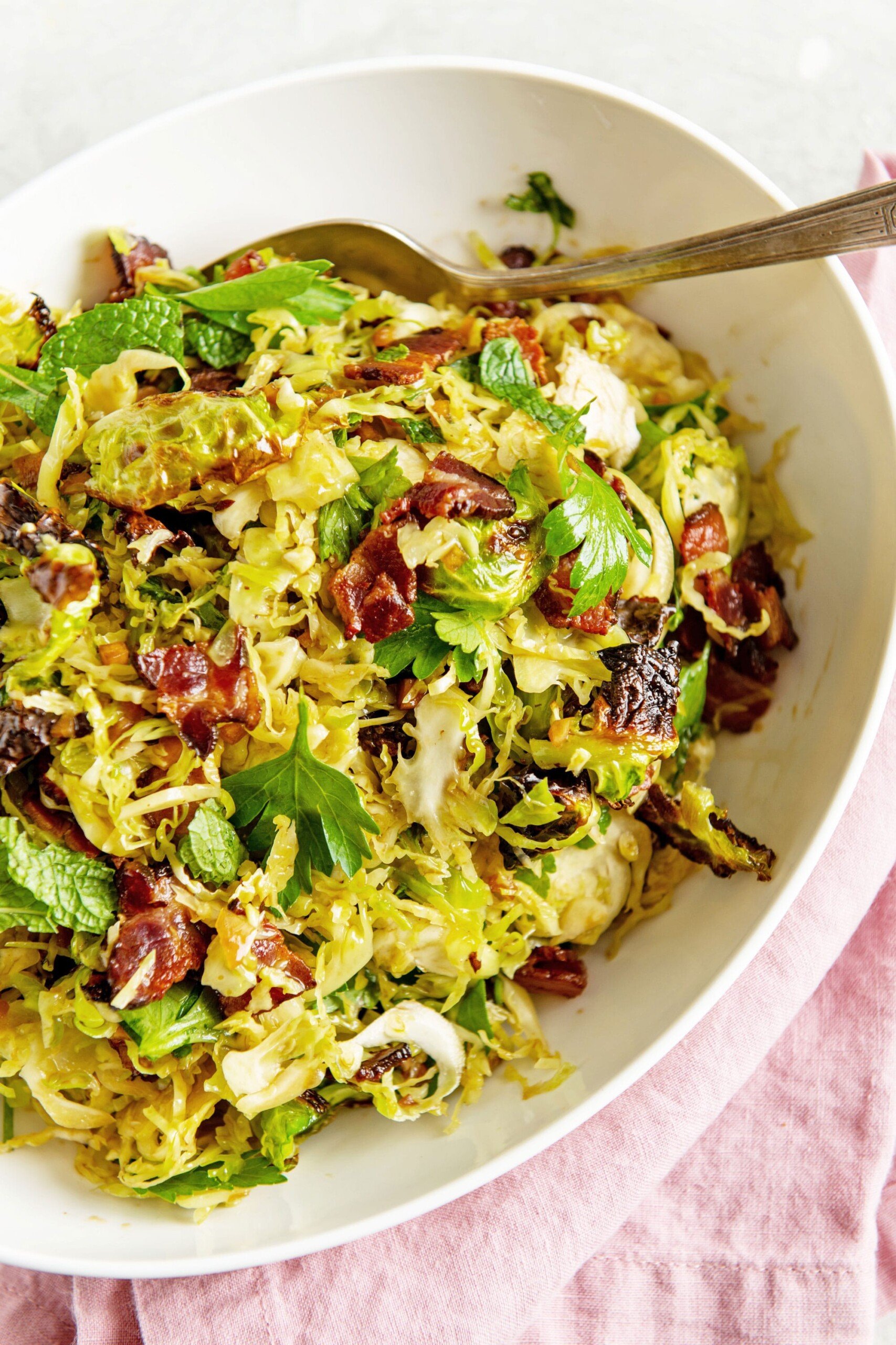 Crispy Brussels Sprouts Salad in bowl on table.