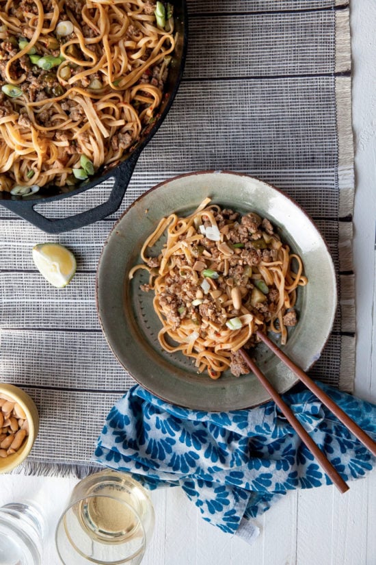 Chopsticks on a plate with Dan Dan Noodles.