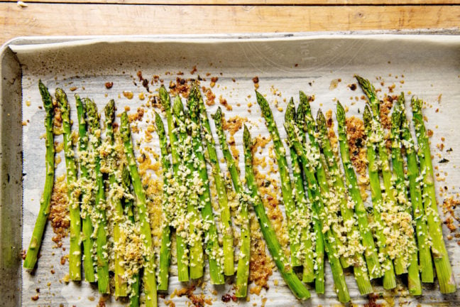 Garlicky Roasted Asparagus with Parmesan on baking sheet