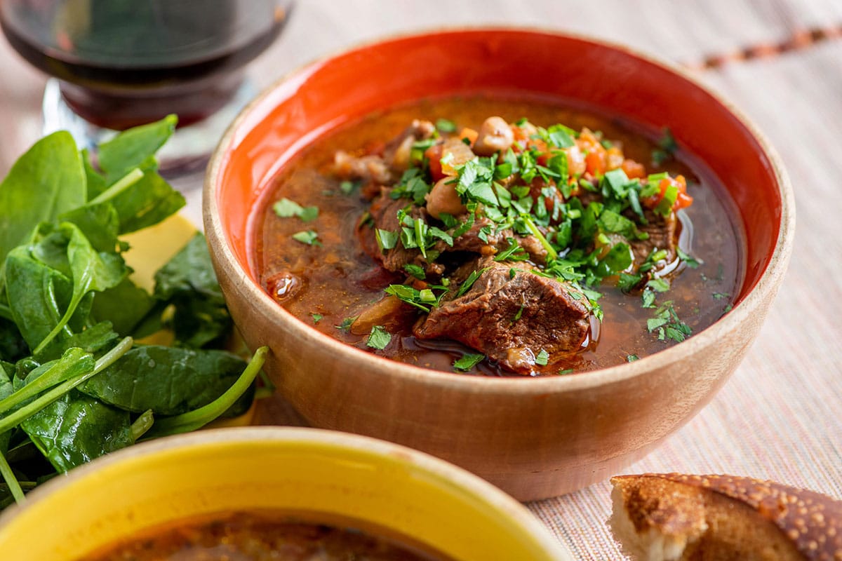 Orange bowl of Mediterranean Lamb Stew.