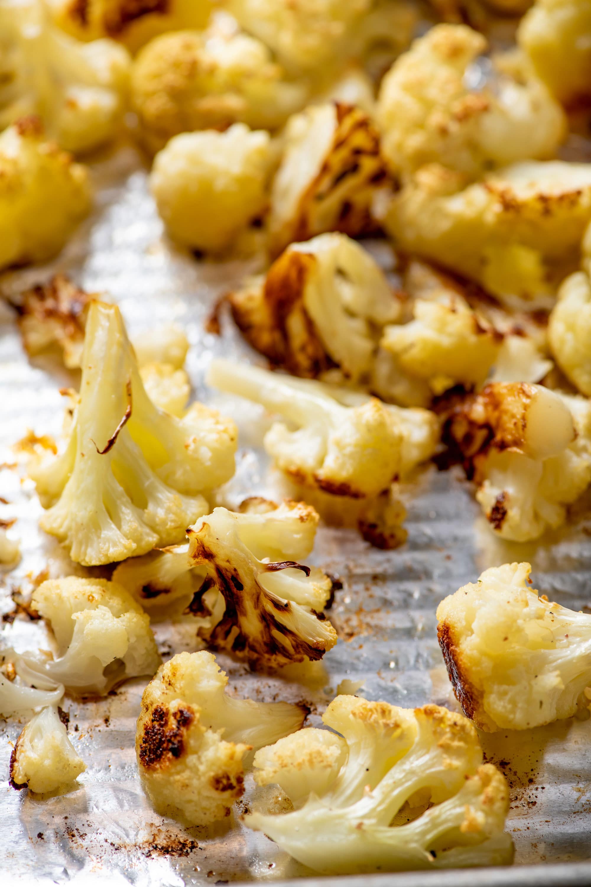 Roasted Cauliflower on a baking sheet lined with foil.
