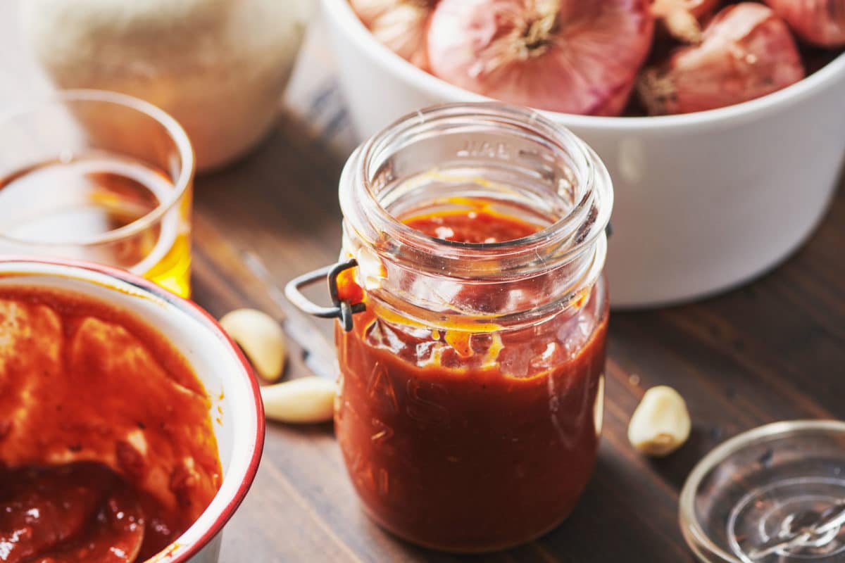 Jar of Barbecue Sauce on a table.