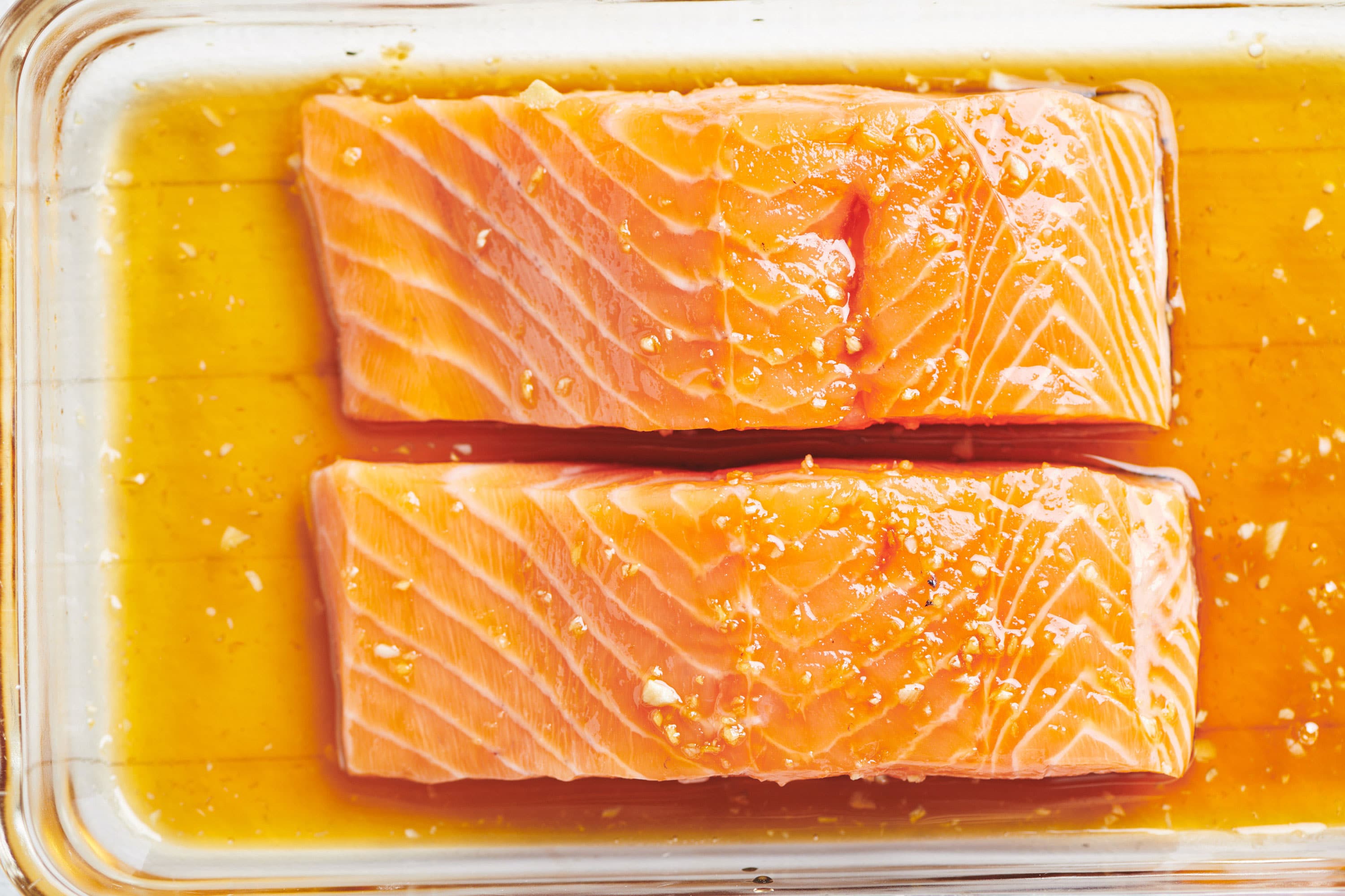 Two Honey Ginger Salmon filets in a baking dish.