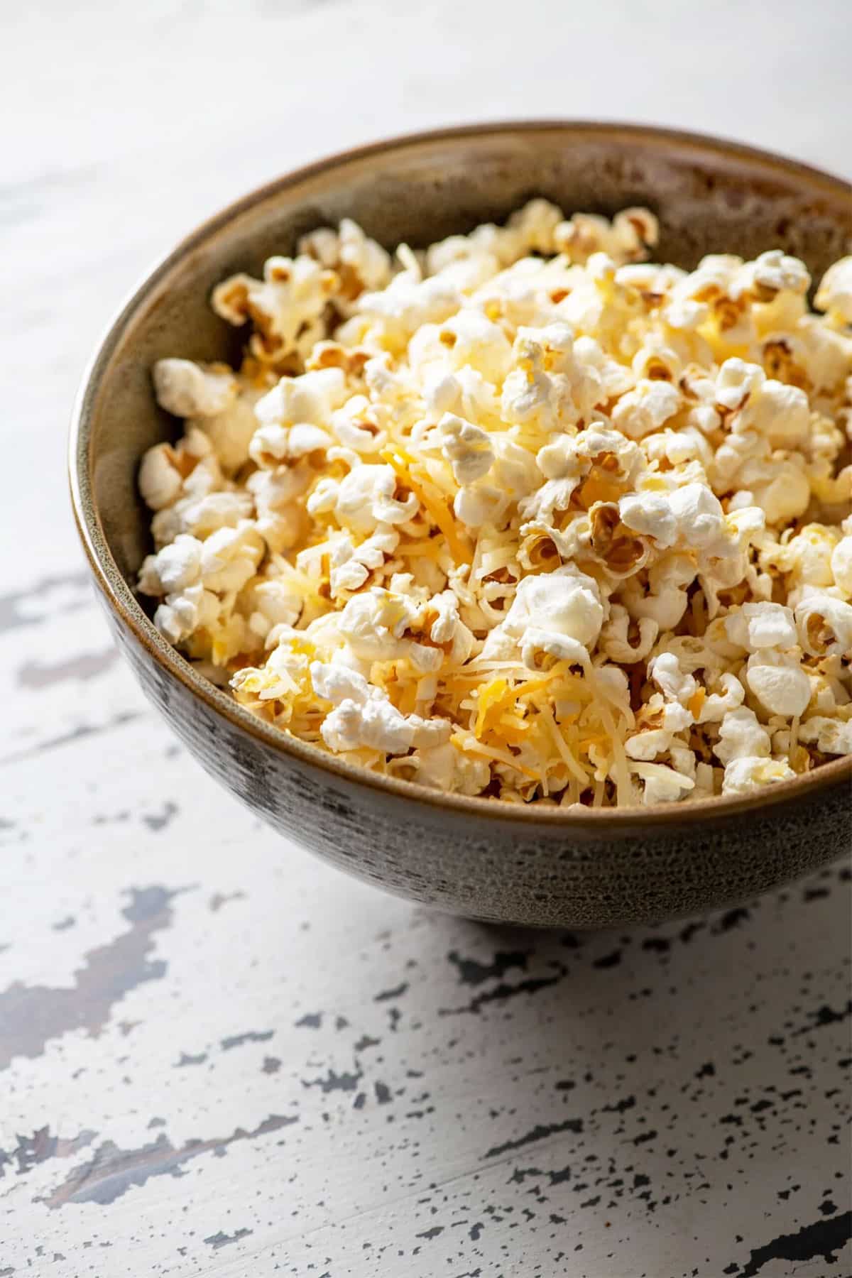 Bowl of Cheddar Cheese Popcorn on table.