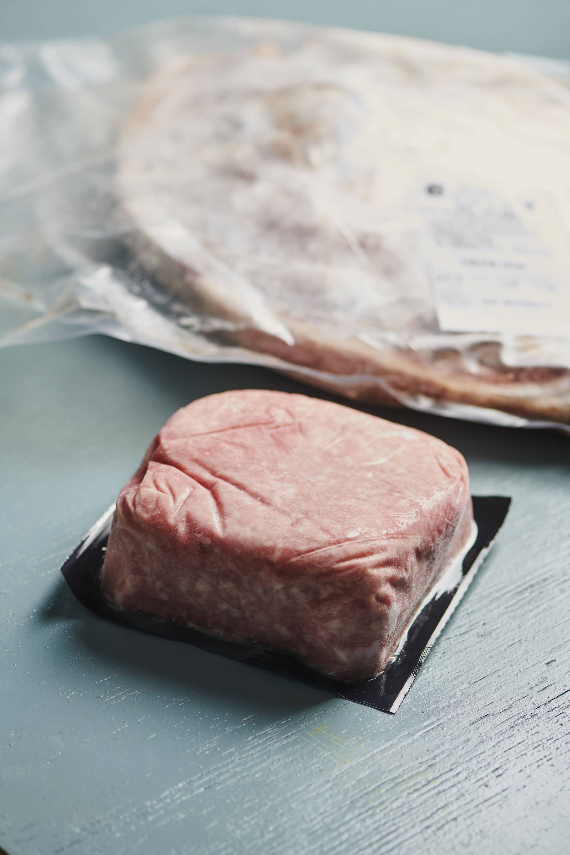 Frozen ground meat in a package.