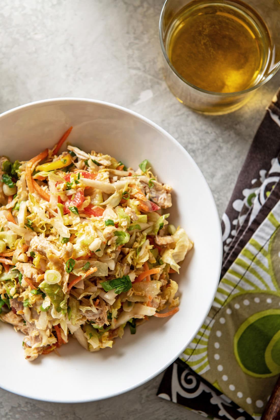 Indonesian Chicken Salad piled high in a white bowl.