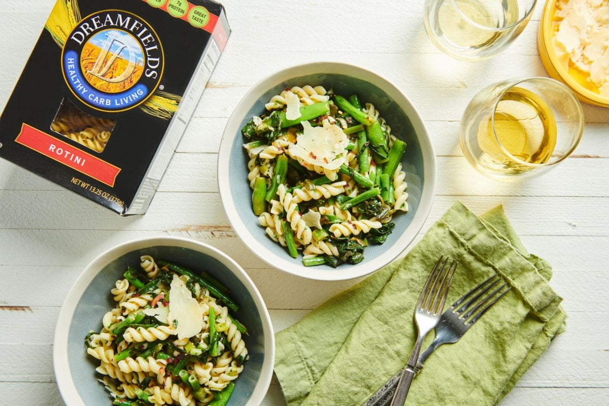 Two bowls of Lemony Rotini with Goat Cheese Sauce and Spring Vegetables.