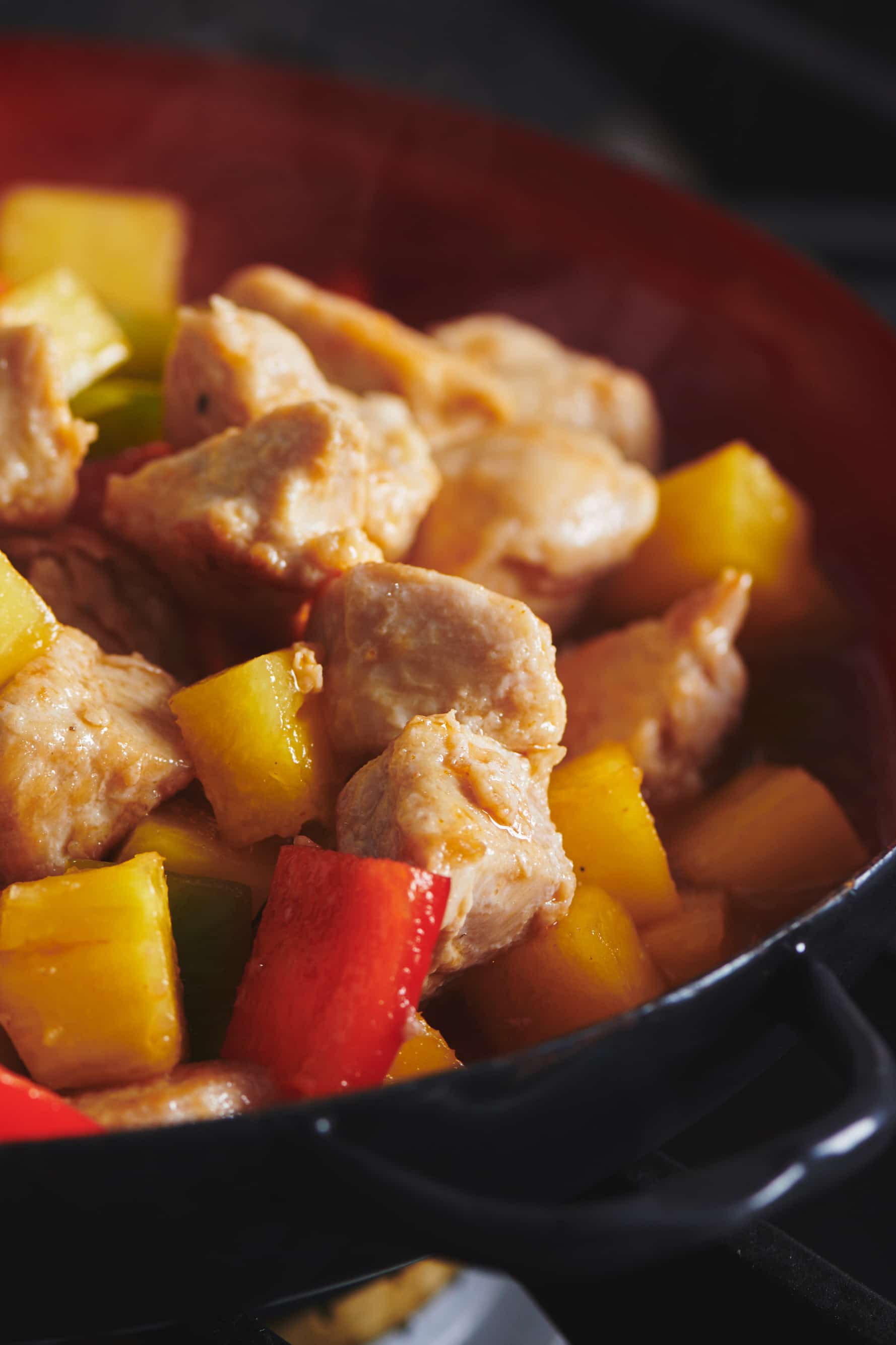 Sweet and Sour Chicken with colorful peppers.
