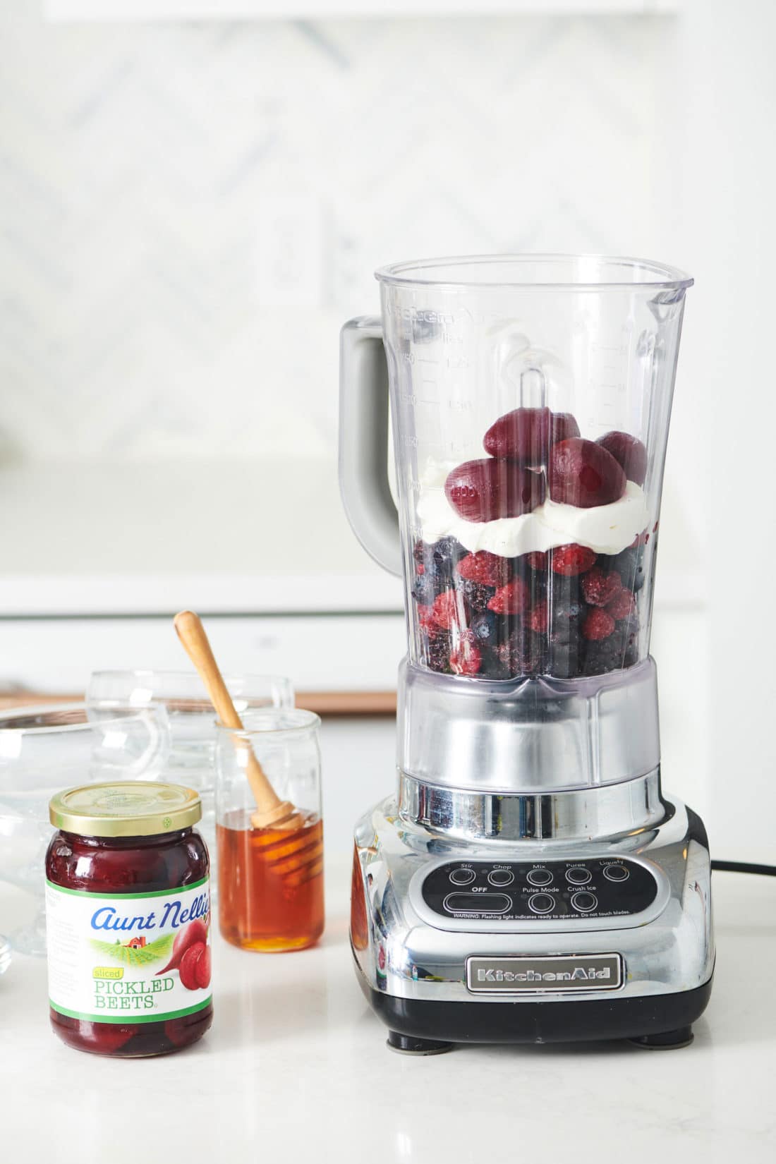 Beet, berries, and yogurt in a blender.