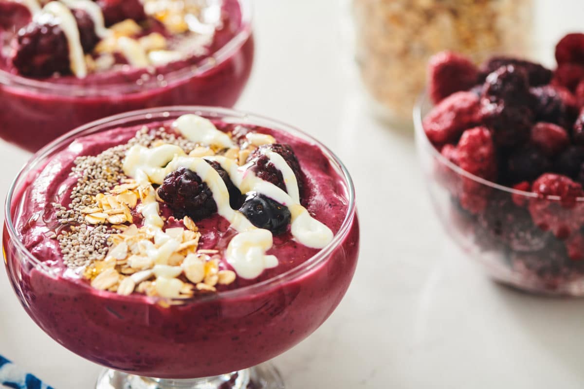 Drizzle of lemony yogurt on a Beet Berry Smoothie Bowl.