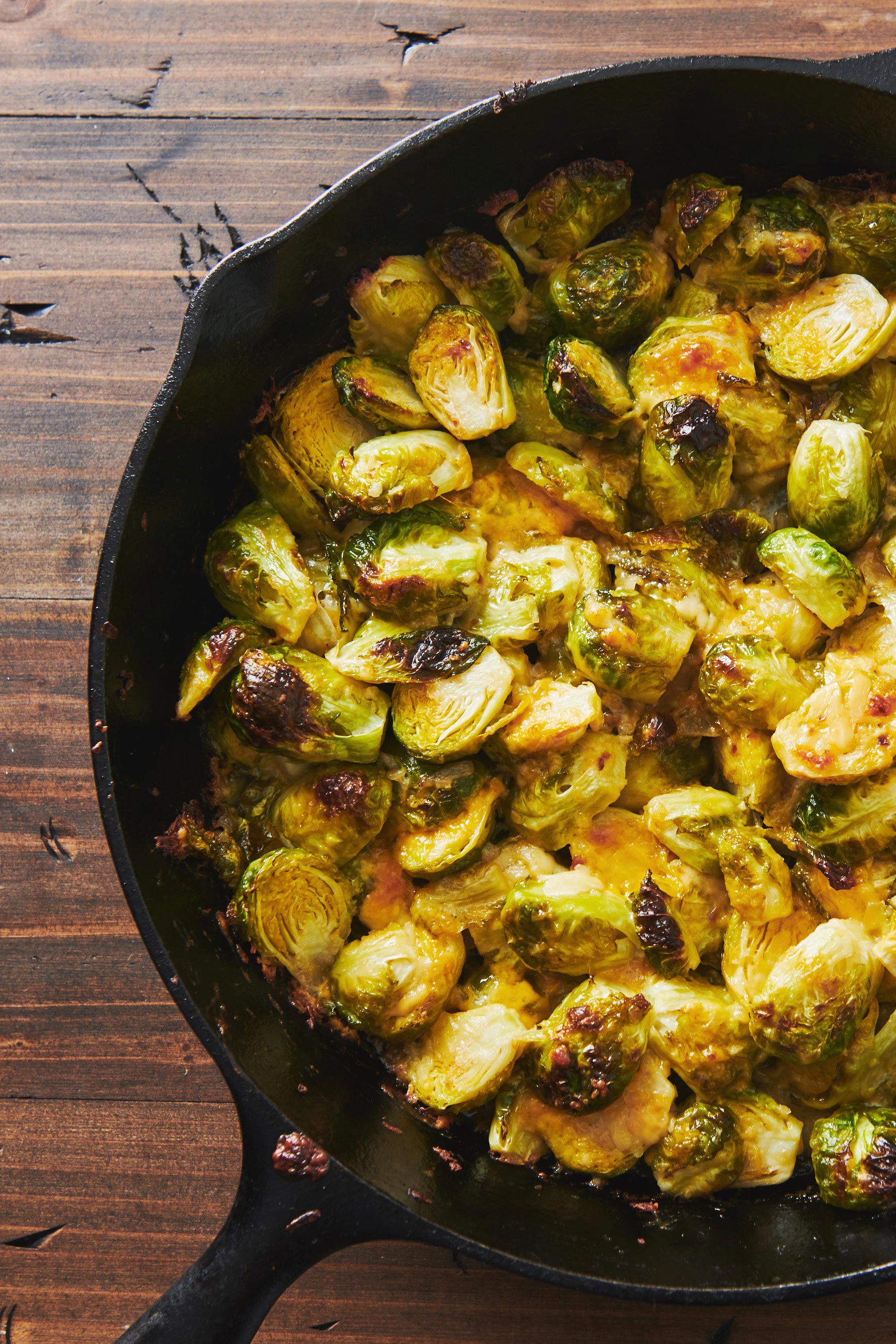 Cheesy Baked Brussels Sprouts in a skillet.