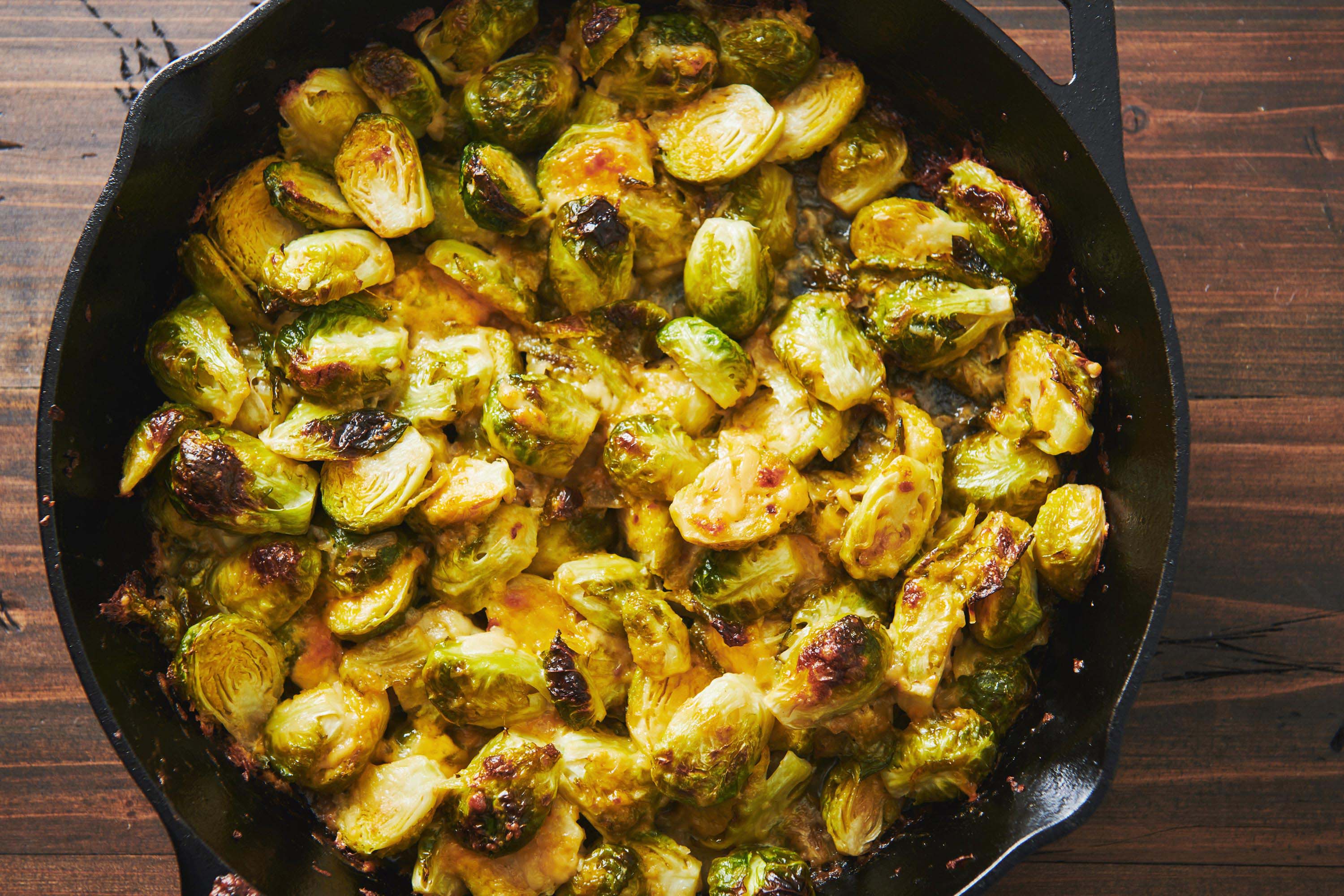 Cheesy Baked Brussels Sprouts in cast iron pan.