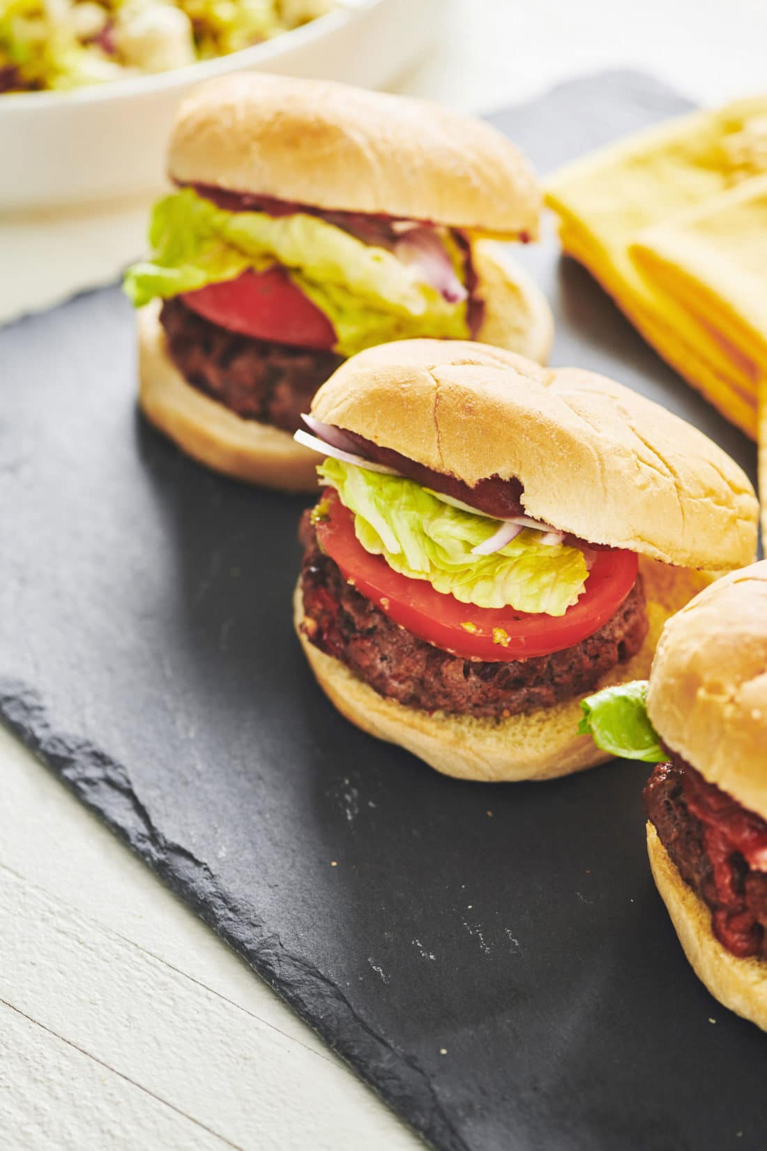 Chipotle Beef Burgers on a black serving platter.