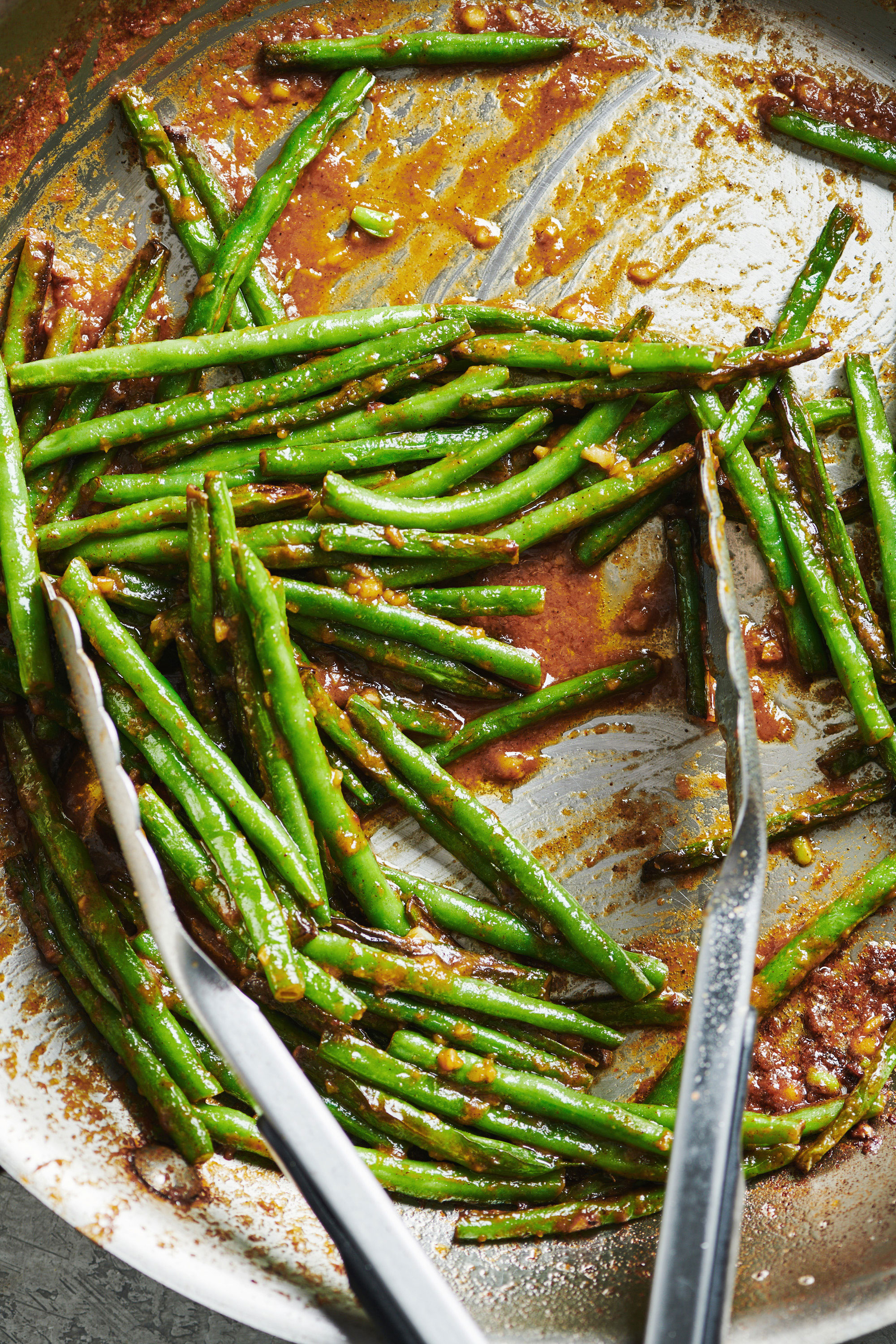 Blistered Green Beans with Miso Butter in a pan.