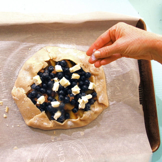 dotting a galette or crostata with butter before baking