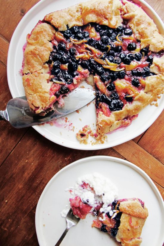 yellow plum and blueberry galette on a plate