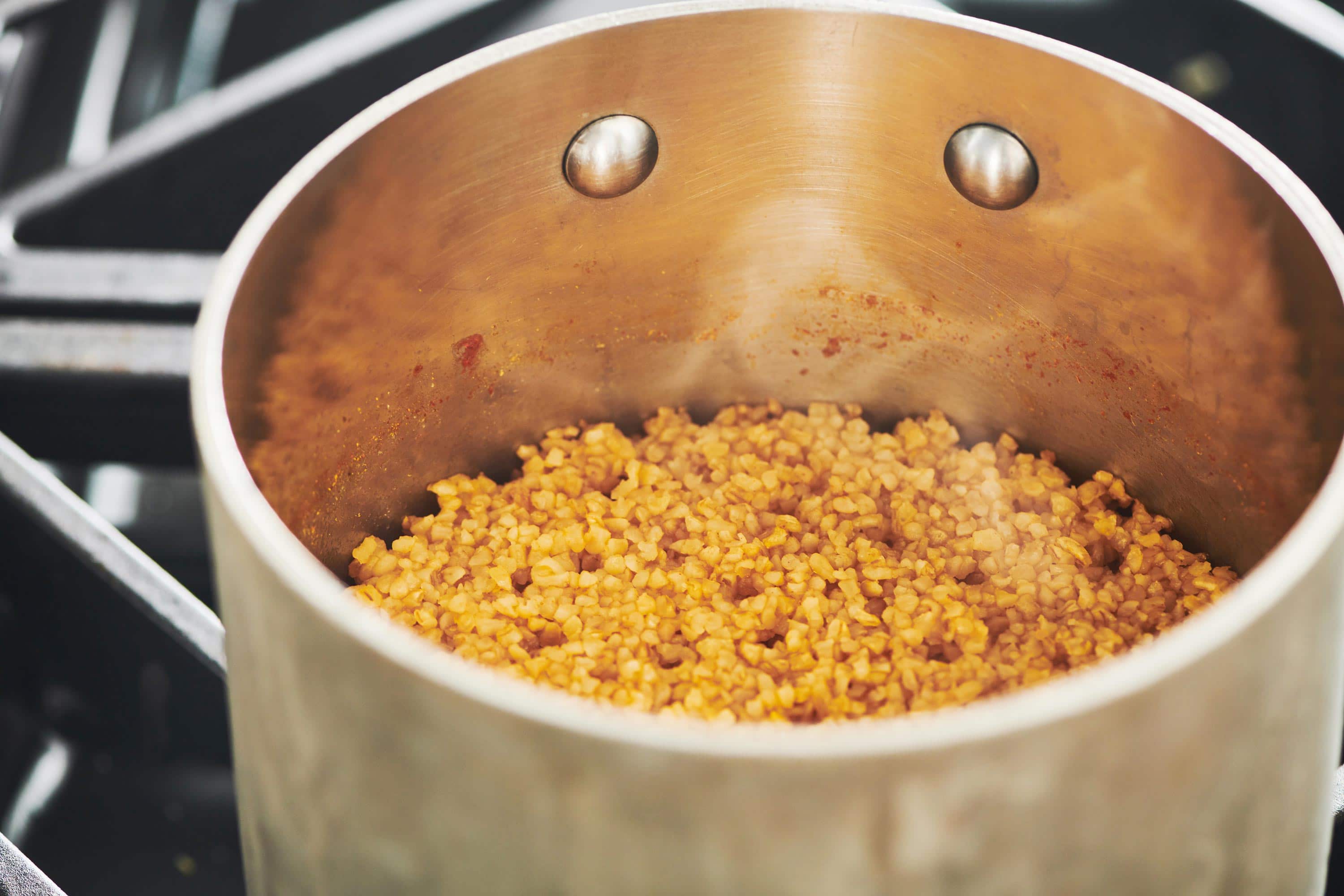 Cooked bulgur wheat in a pot.