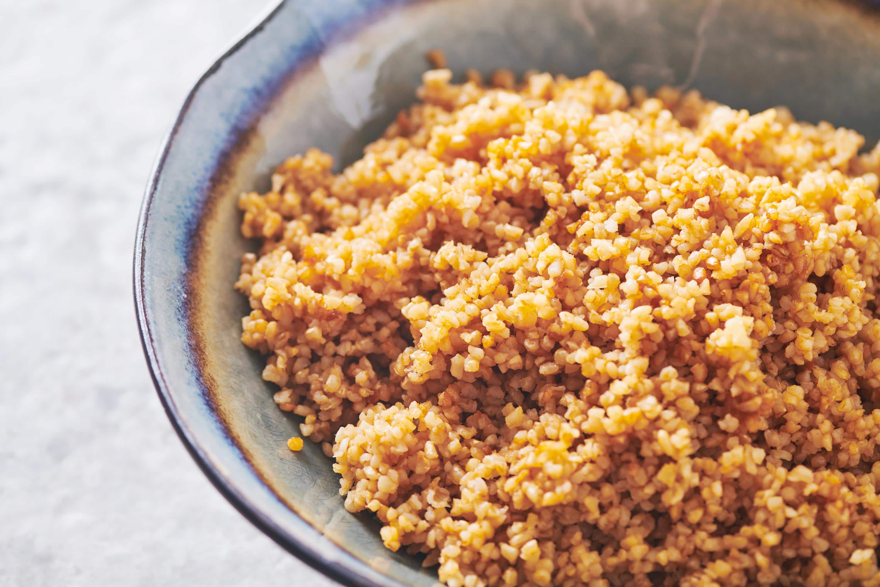 A bowl of cooked bulgur wheat.